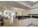 White kitchen with granite countertops and stainless steel appliances at 4516 Seagull Dr # 419, New Port Richey, FL 34652