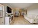 Open concept living area with hardwood floors, dining area and kitchen at 4516 Seagull Dr # 419, New Port Richey, FL 34652