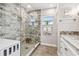 Modern bathroom with walk-in shower, marble vanity, and updated fixtures at 487 9Th N Ave, St Petersburg, FL 33701