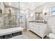 Updated bathroom with a walk-in shower and double vanity at 487 9Th N Ave, St Petersburg, FL 33701