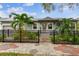 Cute bungalow with a fenced yard, updated landscaping, and a welcoming front porch at 487 9Th N Ave, St Petersburg, FL 33701