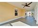Spacious balcony with ceiling fan, offering a tranquil setting at 5614 Seagrass Pl, Apollo Beach, FL 33572