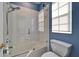 Bathroom with shower/tub combo and window at 5614 Seagrass Pl, Apollo Beach, FL 33572