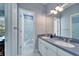 Bathroom with double vanity, shower, and separate tub at 5614 Seagrass Pl, Apollo Beach, FL 33572