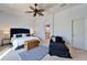 Main bedroom with sitting area and access to en-suite bathroom at 5614 Seagrass Pl, Apollo Beach, FL 33572