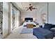 Main bedroom with sitting area and water view at 5614 Seagrass Pl, Apollo Beach, FL 33572