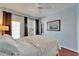 Bedroom with water views and ceiling fan at 5614 Seagrass Pl, Apollo Beach, FL 33572