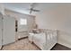 Charming bedroom with white daybed and plantation shutters at 5614 Seagrass Pl, Apollo Beach, FL 33572
