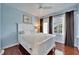 Bedroom with light blue walls and white furniture at 5614 Seagrass Pl, Apollo Beach, FL 33572