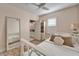 Cozy bedroom with white bed, ensuite bathroom access at 5614 Seagrass Pl, Apollo Beach, FL 33572