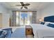 Main bedroom with water view and French doors at 5614 Seagrass Pl, Apollo Beach, FL 33572