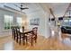 Bright dining room with hardwood floors and view to living room at 5614 Seagrass Pl, Apollo Beach, FL 33572