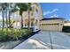 Two-story house with garage and lush landscaping at 5614 Seagrass Pl, Apollo Beach, FL 33572