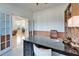 Home office with view into living area at 5614 Seagrass Pl, Apollo Beach, FL 33572