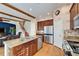 Open kitchen with granite countertops and stainless steel appliances at 5614 Seagrass Pl, Apollo Beach, FL 33572