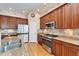 Spacious kitchen with stainless steel appliances and granite counters at 5614 Seagrass Pl, Apollo Beach, FL 33572