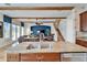 Kitchen island with granite countertop, double sink, and breakfast bar at 5614 Seagrass Pl, Apollo Beach, FL 33572