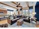 Open living space with hardwood floors and a sectional sofa at 5614 Seagrass Pl, Apollo Beach, FL 33572