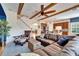 Open living space with exposed beams and comfortable seating at 5614 Seagrass Pl, Apollo Beach, FL 33572