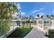 Relaxing patio with seating overlooking the canal at 5614 Seagrass Pl, Apollo Beach, FL 33572