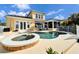 Freeform pool with spa and a large patio area at 5614 Seagrass Pl, Apollo Beach, FL 33572