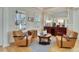 Cozy sitting area with two armchairs, a coffee table, and hardwood floors at 5614 Seagrass Pl, Apollo Beach, FL 33572
