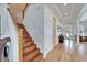 Elegant wooden staircase with a classic design at 5614 Seagrass Pl, Apollo Beach, FL 33572