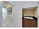 Convenient wet bar with sink and dark wood cabinets at 5614 Seagrass Pl, Apollo Beach, FL 33572