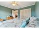 Bedroom with a double bed, built-in closet and view into living room at 7200 Ulmerton Rd # A1, Largo, FL 33771