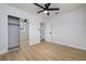 Spacious bedroom with mirrored closet doors and ceiling fan at 8462 8Th N Way, St Petersburg, FL 33702