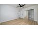 Well-lit bedroom with mirrored closet and ceiling fan at 8462 8Th N Way, St Petersburg, FL 33702
