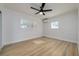 Bright bedroom with window shutters and ceiling fan at 8462 8Th N Way, St Petersburg, FL 33702