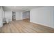 Spacious common area with light wood flooring and access to bathroom at 8462 8Th N Way, St Petersburg, FL 33702