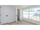 Room with large window, tile floor and small bathroom at 8462 8Th N Way, St Petersburg, FL 33702