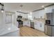 Modern kitchen with white cabinets and stainless steel appliances at 8462 8Th N Way, St Petersburg, FL 33702