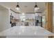 Kitchen island with white quartz countertop and modern pendant lighting at 8462 8Th N Way, St Petersburg, FL 33702