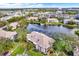 Aerial view of condo community with lake, pool, and lush landscaping at 10265 Gandy N Blvd # 1507, St Petersburg, FL 33702