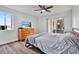 Bedroom with a double bed, dresser, and sliding glass door to balcony at 10265 Gandy N Blvd # 1507, St Petersburg, FL 33702