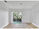 Living room with sliding glass doors leading to patio at 10265 Gandy N Blvd # 1507, St Petersburg, FL 33702