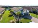 Single-story home with tile roof and landscaped yard at 10338 Highland Park Pl, Palmetto, FL 34221