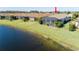 Single-story home with lake view and screened patio at 10338 Highland Park Pl, Palmetto, FL 34221