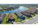 Single-story home with tile roof, located by a lake at 10338 Highland Park Pl, Palmetto, FL 34221