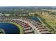 Single-story home with screened patio and lake view at 10338 Highland Park Pl, Palmetto, FL 34221