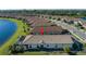 Single-story home with tile roof and screened enclosure at 10338 Highland Park Pl, Palmetto, FL 34221