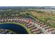 Single-story home with lake view and screened patio at 10338 Highland Park Pl, Palmetto, FL 34221