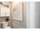 Small powder room with decorative wall art at 10338 Highland Park Pl, Palmetto, FL 34221