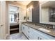 Double vanity bathroom with access to bedroom and closet at 10338 Highland Park Pl, Palmetto, FL 34221