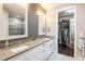 Double vanity bathroom with large walk-in closet at 10338 Highland Park Pl, Palmetto, FL 34221