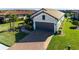 Single-Gathering home with two-car garage and manicured landscaping at 10338 Highland Park Pl, Palmetto, FL 34221