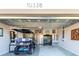 Garage with golf cart, storage cabinets, and epoxy flooring at 10338 Highland Park Pl, Palmetto, FL 34221